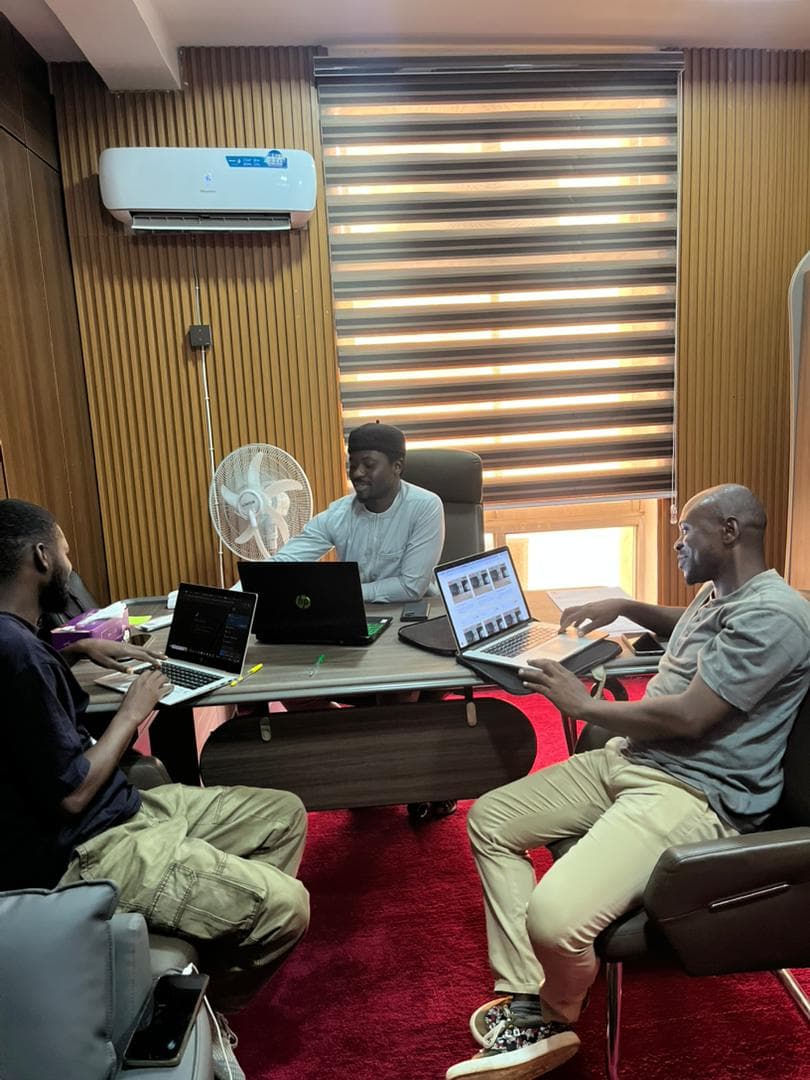Business team reviewing technology and operations together
